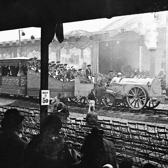The Stephenson locomotive, Northumbrian, hauling a train carrying passengers and a brass band in Liverpool in 1930.