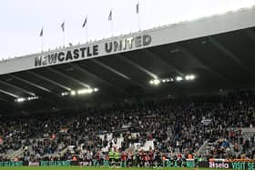 Newcastle's players celebrate with their fans on the pitch after the English Premier League football match between Newcastle United and Arsenal at St James' Park in Newcastle-upon-Tyne, north east England on November 2, 2024. Newcastle won the game 1-0. (Photo by Paul ELLIS / AFP) 