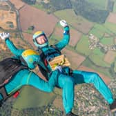 Parachuters performed mid-air manoeuvres which saw the bright turquoise liquid shaken and stirred from heights up to 10,000ft