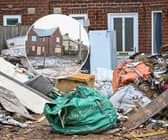 Before-and-after pictures show how a house of horrors which was turned into a makeshift dump has finally been cleared of rubbish after more than a year. 