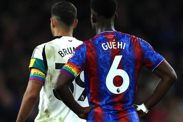 Bruno Guimaraes of Newcastle United and Marc Guehi of Crystal Palace wear the Rainbow Laces captains armband during the Premier League match between Crystal Palace FC and Newcastle United FC at Selhurst Park on November 30, 2024 in London, England. (Photo by Eddie Keogh/Getty Images)