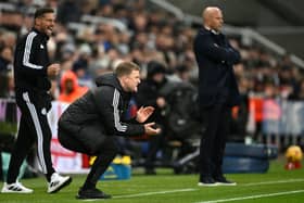 Eddie Howe, Manager of Newcastle United, reacts as Arne Slot, Manager of Liverpool, looks on during the Premier League match. (Photo by Stu Forster/Getty Images)