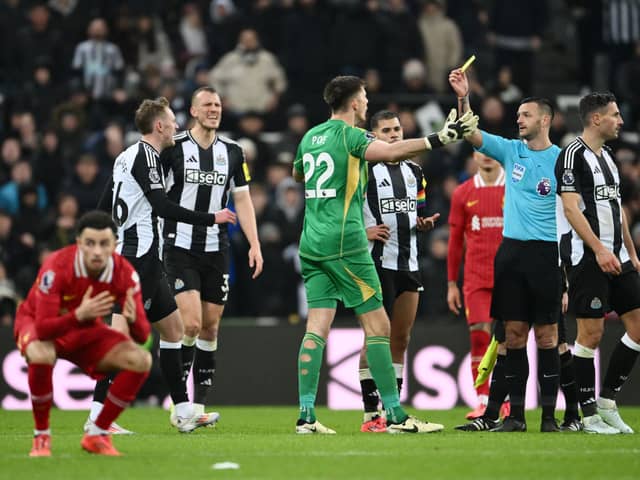 Nick Pope of Newcastle United reacts as he is shown a yellow card by Referee Andy Madley during the Premier League match between Newcastle United FC and Liverpool FC at St James' Park on December 04, 2024 in Newcastle upon Tyne, England. (Photo by Stu Forster/Getty Images)