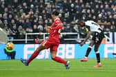Alexander Isak of Newcastle United scores his team's first goal whilst under pressure from Virgil van Dijk of Liverpool during the Premier League match between Newcastle United FC and Liverpool FC at St James' Park on December 04, 2024 in Newcastle upon Tyne, England. (Photo by Justin Setterfield/Getty Images)
