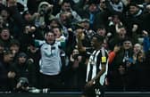 Newcastle United's Swedish striker #14 Alexander Isak celebrates scoring the opening goal against Liverpool. (Photo by Paul ELLIS / AFP) 