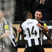 Fabian Scher of Newcastle United celebrates scoring his team's third goal with teammate Alexander Isak during the Premier League match between Newcastle United FC and Liverpool FC at St James' Park. (Photo by Stu Forster/Getty Images)