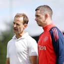 Dan Ashworth speaks to Manager Marc Skinner of Manchester United Women in action during a training session at St Georges Park on August 09, 2024 in Burton-upon-Trent, England.  (Photo by Charlotte Tattersall - MUFC/Manchester United via Getty Images)