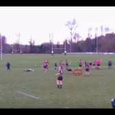 Video grab shows the moment a deer invaded a rugby pitch - and tackled a player. 