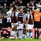 Jhon Duran of Aston Villa is shown a red card from match referee Anthony Taylor after fouling Fabian Schaer of Newcastle United during the Premier League match between Newcastle United FC and Aston Villa FC at St James' Park on December 26, 2024 in Newcastle upon Tyne, England. (Photo by Stu Forster/Getty Images)