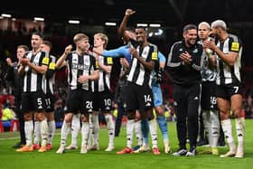 Alexander Isak of Newcastle United, gestures to the fans as he celebrates with his teammates at the end of the Premier League match between Manchester United FC and Newcastle United. (Photo by Stu Forster/Getty Images)