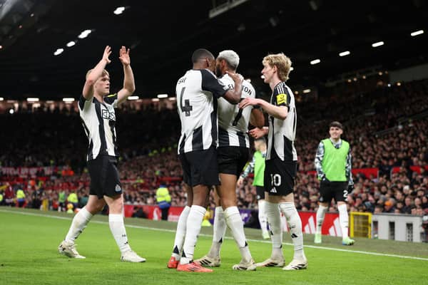 Joelinton of Newcastle United celebrates scoring his team's second goal with teammate during the Premier League match between Manchester United FC and Newcastle United FC at Old Trafford. (Photo by Carl Recine/Getty Images)