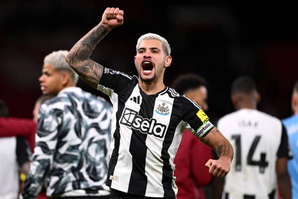 Bruno Guimaraes of Newcastle United celebrates at the end of the Premier League match between Manchester United FC and Newcastle United.. (Photo by Stu Forster/Getty Images)