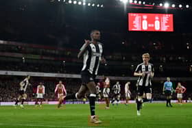 Newcastle United's Swedish striker #14 Alexander Isak celebrates scoring the opening goal during the English League Cup semi-final first leg football match between Arsenal and Newcastle United at the Emirates Stadium, in London on January 7, 2025. (Photo by Glyn KIRK / AFP) 