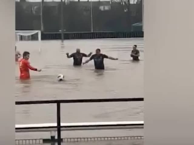 Lydney Town AFC players swim in flooded pitch