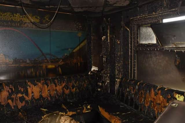 The barbour shop was left in ruins after the arson attack.