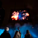 Visuals of a blue whale, northern lights, and football tricks are displayed in a hologram show over London