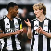 Newcastle United's English midfielder Joe Willock (L) and Anthony Gordon speak at the end of the English Premier League football match between Newcastle United and Bournemouth at St James' Park.