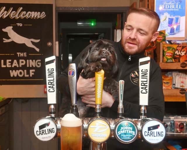 Manager Dan Morris, with Shih Tzu, Rex