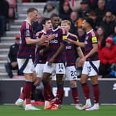 Alexander Isak of Newcastle United celebrates scoring his team's second goal with teammates during the Premier League match between Southampton FC and Newcastle United FC. (Photo by Ryan Pierse/Getty Images)