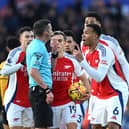 Gabriel of Arsenal and his teammates protest to Referee Michael Oliver after Myles Lewis-Skelly of Arsenal (not pictured) is shown a red card for a foul on Matt Doherty of Wolverhampton Wanderers. (Photo by Shaun Botterill/Getty Images)