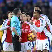 Gabriel of Arsenal and his teammates protest to Referee Michael Oliver after Myles Lewis-Skelly of Arsenal (not pictured) is shown a red card for a foul on Matt Doherty of Wolverhampton Wanderers. (Photo by Shaun Botterill/Getty Images)