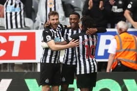 Paul Dummett (left), Joe Willock (centre) and former Newcastle United teammate Allan Saint-Maximin