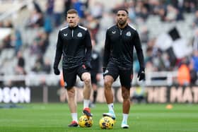 Harvey Barnes and Callum Wilson of Newcastle United look on as the team warms up prior to the Premier League match between Newcastle United and Luton Town at St. James Park on February 03, 2024 in Newcastle upon Tyne, England. (Photo by Matt McNulty/Getty Images)