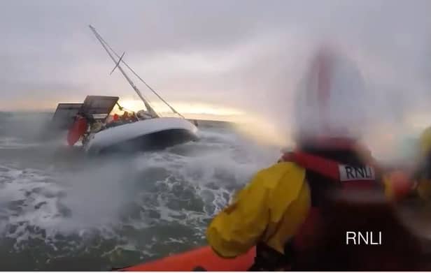 RNLI preparing to rescue passengers on a yacht