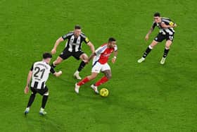 Gabriel Jesus of Arsenal runs with the ball under pressure from Tino Livramento, Sven Botman and Miguel Almirn of Newcastle United during the Carabao Cup Semi Final First Leg match between Arsenal and Newcastle United at Emirates Stadium on January 07, 2025 in London, England. (Photo by Alex Burstow/Arsenal FC via Getty Images)