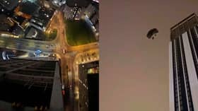 Base jumper parachutes off 500ft skyscraper.
