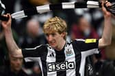 Newcastle United's English midfielder #10 Anthony Gordon celebrates after scoring his team's second goal during the English League Cup semi-final second leg football match between Newcastle United and Arsenal at St James' Park, in Newcastle-upon-Tyne, north east England, on February 5, 2025. (Photo by Paul ELLIS / AFP)    