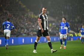 Dan Burn of Newcastle United reacts, while holding his leg during the Emirates FA Cup Fourth Round match between Birmingham City and Newcastle United at St Andrewâs at Knighthead Park on February 08, 2025 in Birmingham, England. (Photo by Michael Regan/Getty Images)