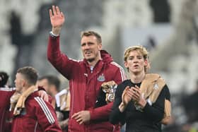 Newcastle United's English defender #33 Dan Burn (L) and Newcastle United's English midfielder #10 Anthony Gordon (R) gesture to fans. 