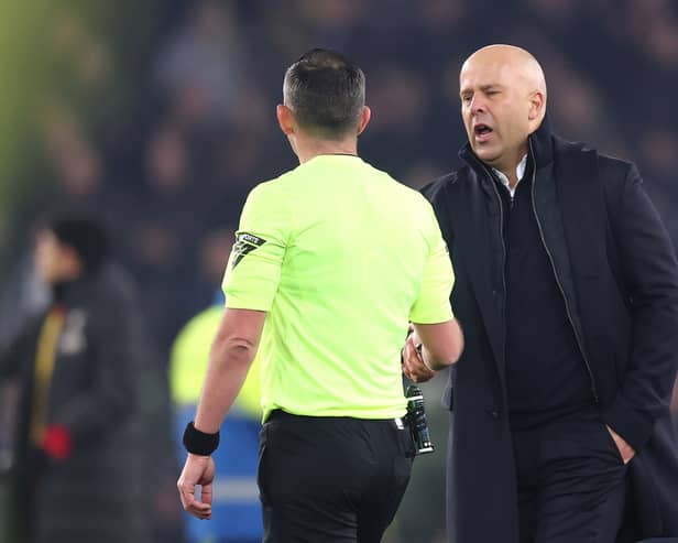 Arne Slot, Manger of Liverpool, shakes hands with Match Referee Michael Oliver following the Premier League match between Everton FC and Liverpool FC at Goodison Park on February 12, 2025 in Liverpool, England. (Photo by Carl Recine/Getty Images)