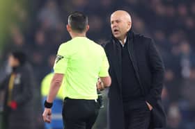 Arne Slot, Manger of Liverpool, shakes hands with Match Referee Michael Oliver following the Premier League match between Everton FC and Liverpool FC at Goodison Park on February 12, 2025 in Liverpool, England. (Photo by Carl Recine/Getty Images)