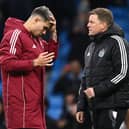 Bruno Guimaraes of Newcastle reacts as head coach Eddie Howe looks on after the Premier League match between Manchester City FC and Newcastle United FC at Etihad Stadium on February 15, 2025 in Manchester, England. (Photo by Stu Forster/Getty Images)