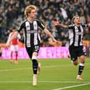 Anthony Gordon and Bruno Guimaraes of Newcastle United.