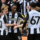 Newcastle United's Swedish striker #14 Alexander Isak (2L) celebrates with teammates after scoring their fourth goal during the English Premier League football match between Newcastle United and Nottingham Forest at St James' Park in Newcastle-upon-Tyne, north east England on February 23, 2025. (Photo by ANDY BUCHANAN / AFP)     