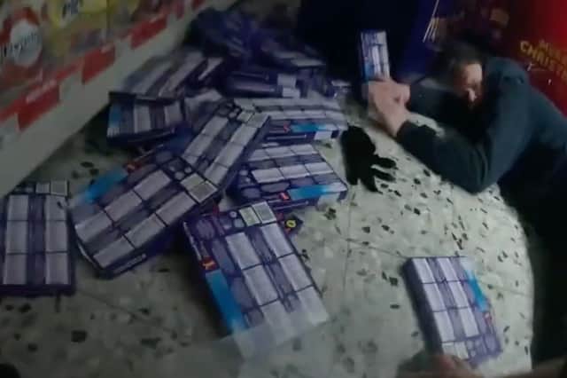 Damian Smith lies on the ground as Callum Knox grapples with an officer during supermarket robbery in Sevenoaks, Kent, November 22 2024.