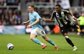 Elliot Anderson of Nottingham Forest is challenged by Joe Willock of Newcastle United during the Premier League match between Newcastle United FC and Nottingham Forest FC at St James' Park on February 23, 2025 in Newcastle upon Tyne, England. (Photo by Richard Heathcote/Getty Images)