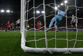 Liverpool's Argentinian midfielder #10 Alexis Mac Allister (L) scores the team's second goal during the English Premier League football match between Liverpool and Newcastle United at Anfield in Liverpool, north west England on February 26, 2025. (Photo by Paul ELLIS / AFP)          