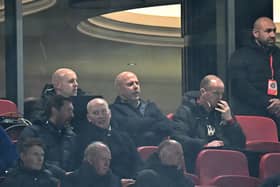 Liverpool's Dutch manager Arne Slot (C) watches the players from the stands during the English Premier League football match between Liverpool and Newcastle United at Anfield in Liverpool, north west England on February 26, 2025. (Photo by Paul ELLIS / AFP) 