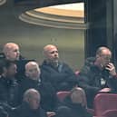 Liverpool's Dutch manager Arne Slot (C) watches the players from the stands during the English Premier League football match between Liverpool and Newcastle United at Anfield in Liverpool, north west England on February 26, 2025. (Photo by Paul ELLIS / AFP) 
