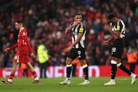 Callum Wilson and Joe Willock of Newcastle United look dejected during the Premier League match between Liverpool FC and Newcastle United FC at Anfield on February 26, 2025 in Liverpool, England. (Photo by Carl Recine/Getty Images)