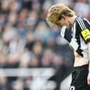 Newcastle United's English midfielder #10 Anthony Gordon leaves the pitch after receiving a red card during the English FA Cup fifth round football match between Newcastle United and Brighton and Hove Albion at St. James' Park in Newcastle-upon-Tyne, north east England on March 2, 2025. (Photo by ANDY BUCHANAN / AFP)