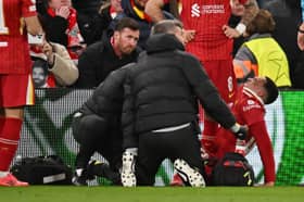 Trent Alexander-Arnold of Liverpool receives medical treatment during the UEFA Champions League 2024/25 Round of 16 Second Leg match between Liverpool FC and Paris Saint-Germain at Anfield on March 11, 2025 in Liverpool, England. (Photo by Liverpool FC/Liverpool FC via Getty Images)