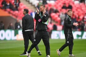 LONDON, ENGLAND - MARCH 16: Dan Burn of Newcastle United applauds the fans as he inspects the pitch prior to the Carabao Cup Final between Liverpool and Newcastle United at Wembley Stadium on March 16, 2025 in London, England. (Photo by Stu Forster/Getty Images)