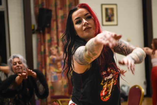 Sookie Scarlett, burlesque dancer stretches out in her pyjamas