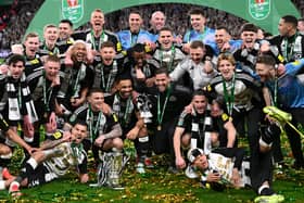 The Newcastle United squad and members of the coaching staff celebrate in a team picture after the Carabao Cup Final between Liverpool and Newcastle United at Wembley Stadium on March 16, 2025 in London, England. (Photo by Stu Forster/Getty Images)
