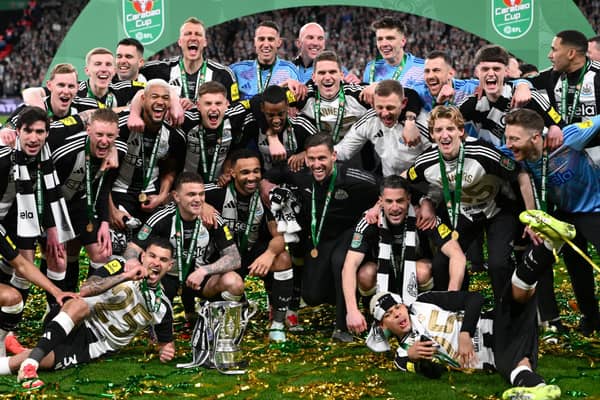 The Newcastle United squad and members of the coaching staff celebrate in a team picture after the Carabao Cup Final between Liverpool and Newcastle United at Wembley Stadium on March 16, 2025 in London, England. (Photo by Stu Forster/Getty Images)